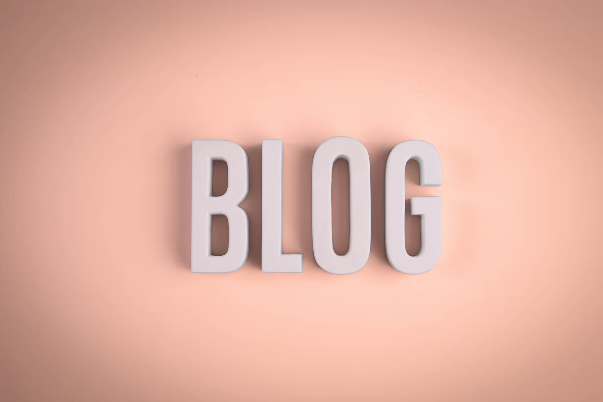 A palavra BLOG em letras brancas em relevo, sobre fundo rosa.